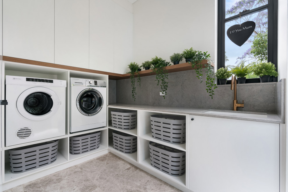 Laundry room - contemporary laundry room idea in Sydney