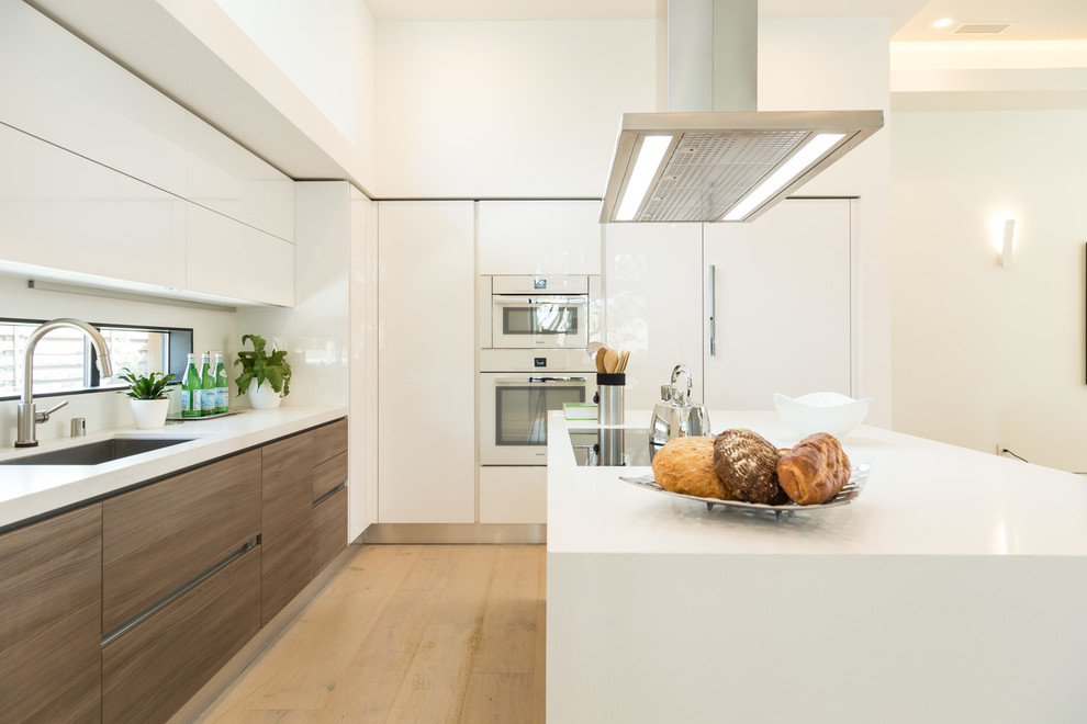 Inspiration for a large modern single-wall eat-in kitchen in Other with quartz benchtops and with island.
