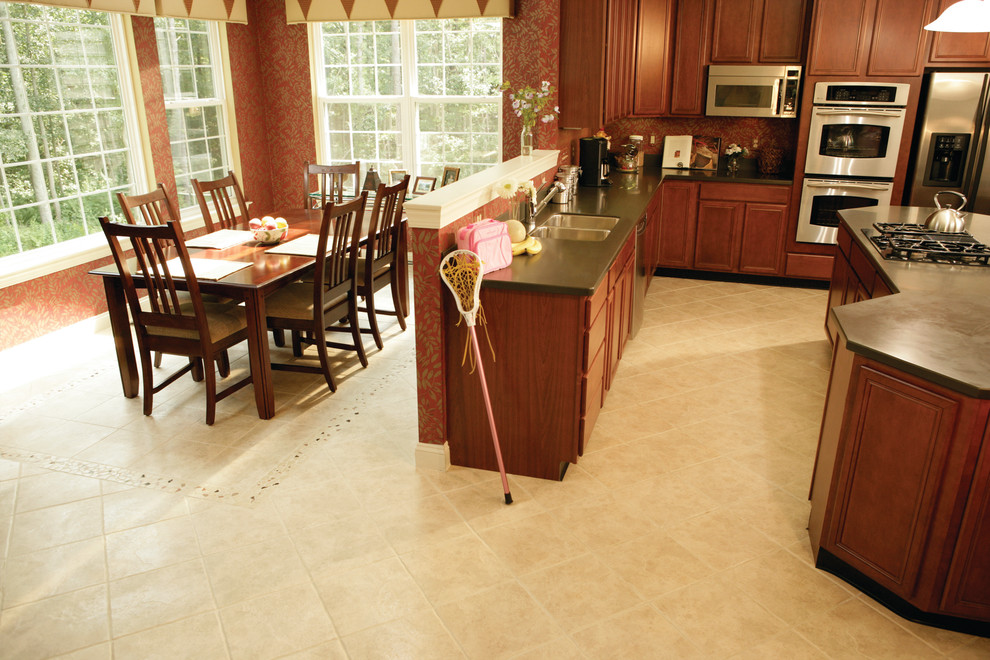 Eat-in kitchen - transitional u-shaped porcelain tile eat-in kitchen idea in Miami with a double-bowl sink, dark wood cabinets, stainless steel appliances and an island