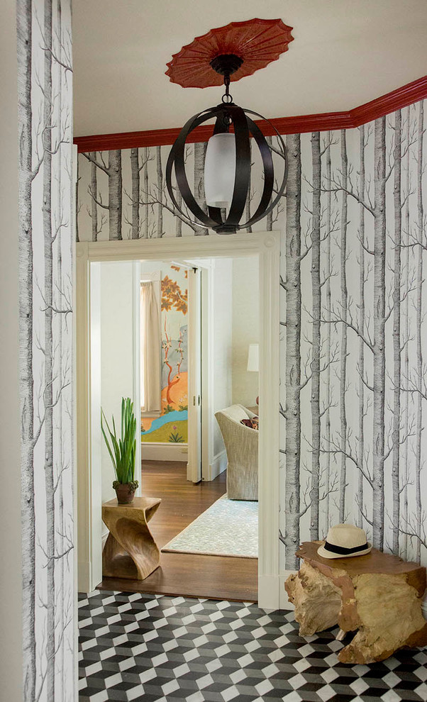 Photo of a small contemporary hallway in Boston with black walls and marble floors.