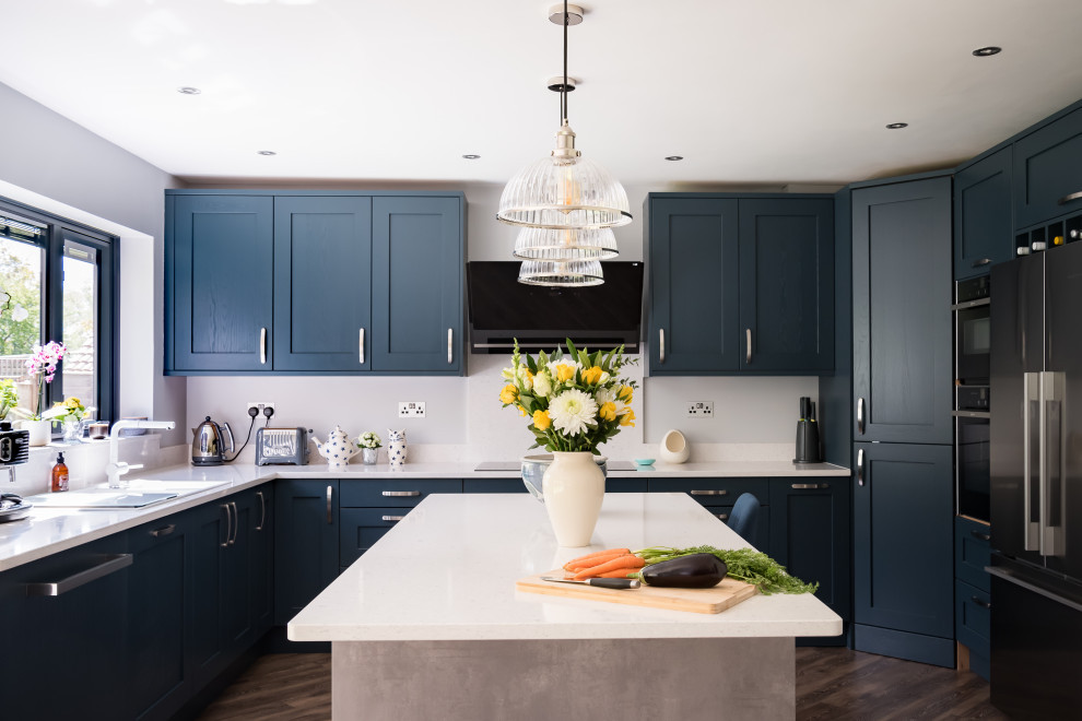 Example of a large transitional u-shaped eat-in kitchen design in Berkshire with shaker cabinets, blue cabinets, quartzite countertops and an island