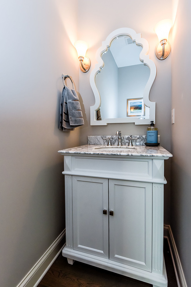 This is an example of a traditional powder room in Other.