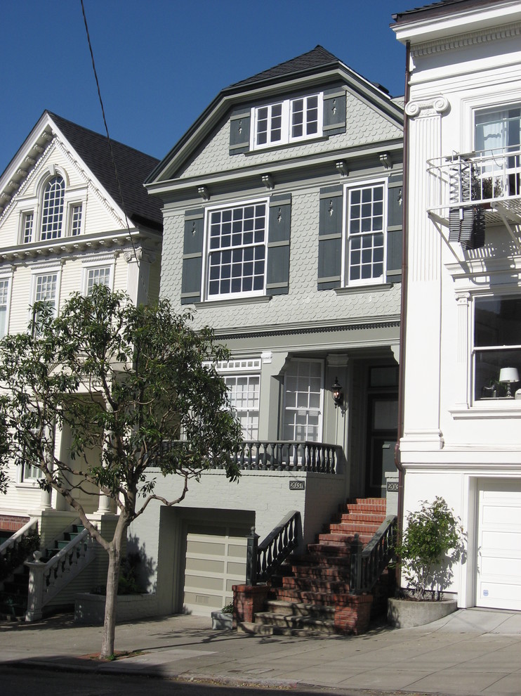 Elegant three-story wood exterior home photo in San Francisco with a clipped gable roof