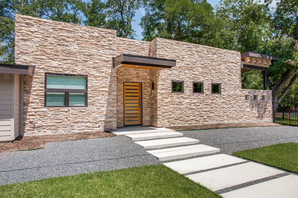 Design ideas for a contemporary one-storey exterior in Dallas with stone veneer and a flat roof.