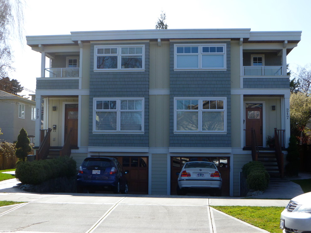 Large modern three-storey duplex exterior in Vancouver with a flat roof.