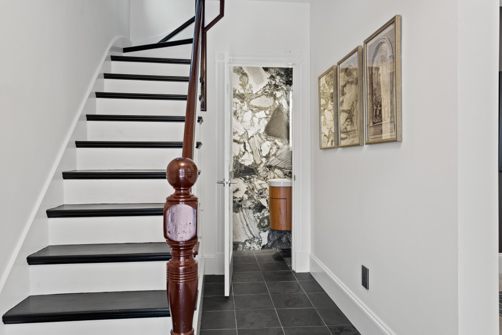 Design ideas for a mid-sized modern wood l-shaped staircase in Boston with painted wood risers and wood railing.