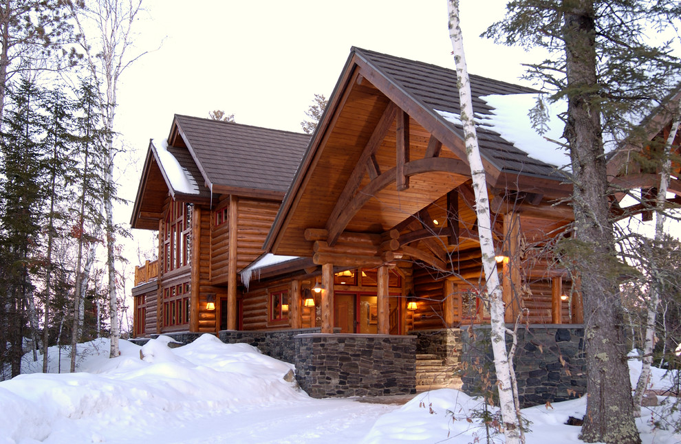 This is an example of a country two-storey exterior in Minneapolis with wood siding.