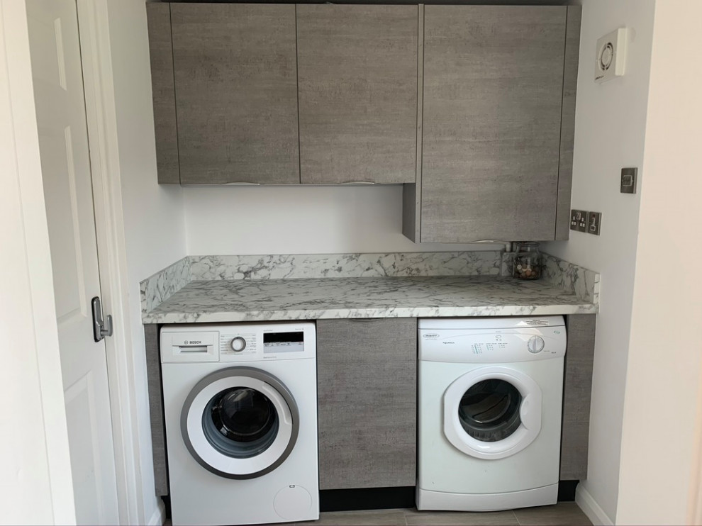 Design ideas for a small laundry room in Buckinghamshire with grey cabinets and laminate benchtops.