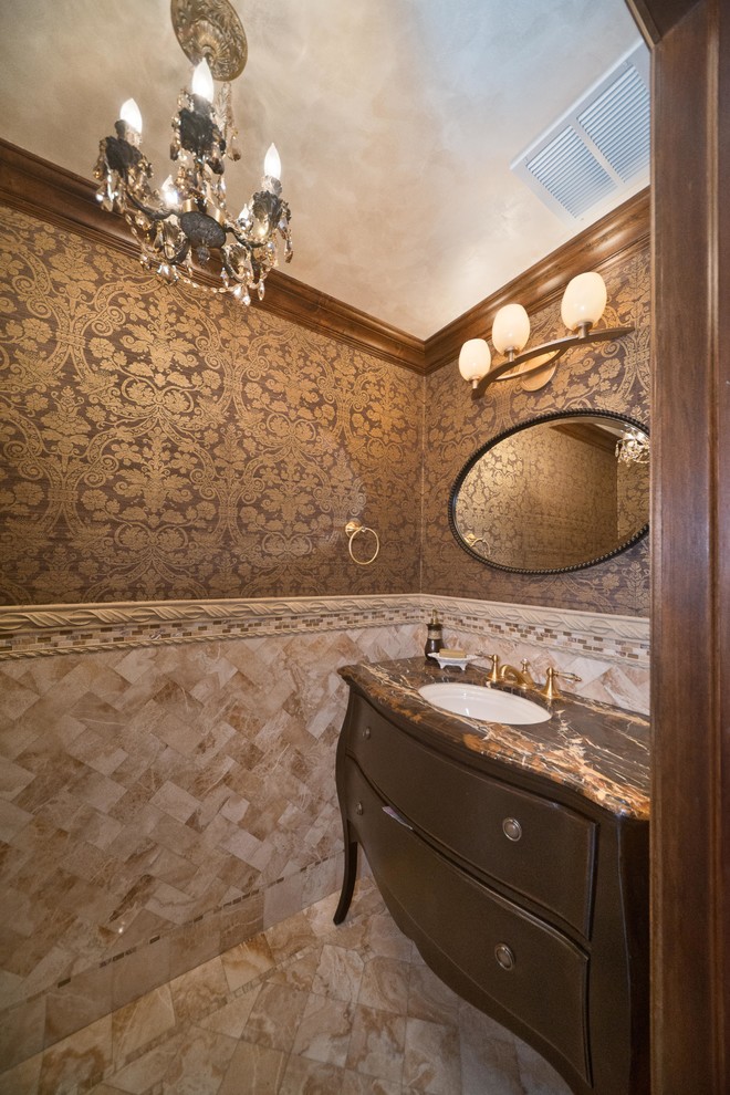 Photo of a mid-sized traditional powder room in New York with furniture-like cabinets, dark wood cabinets, multi-coloured tile, marble, multi-coloured walls, marble floors, an undermount sink, granite benchtops and multi-coloured floor.