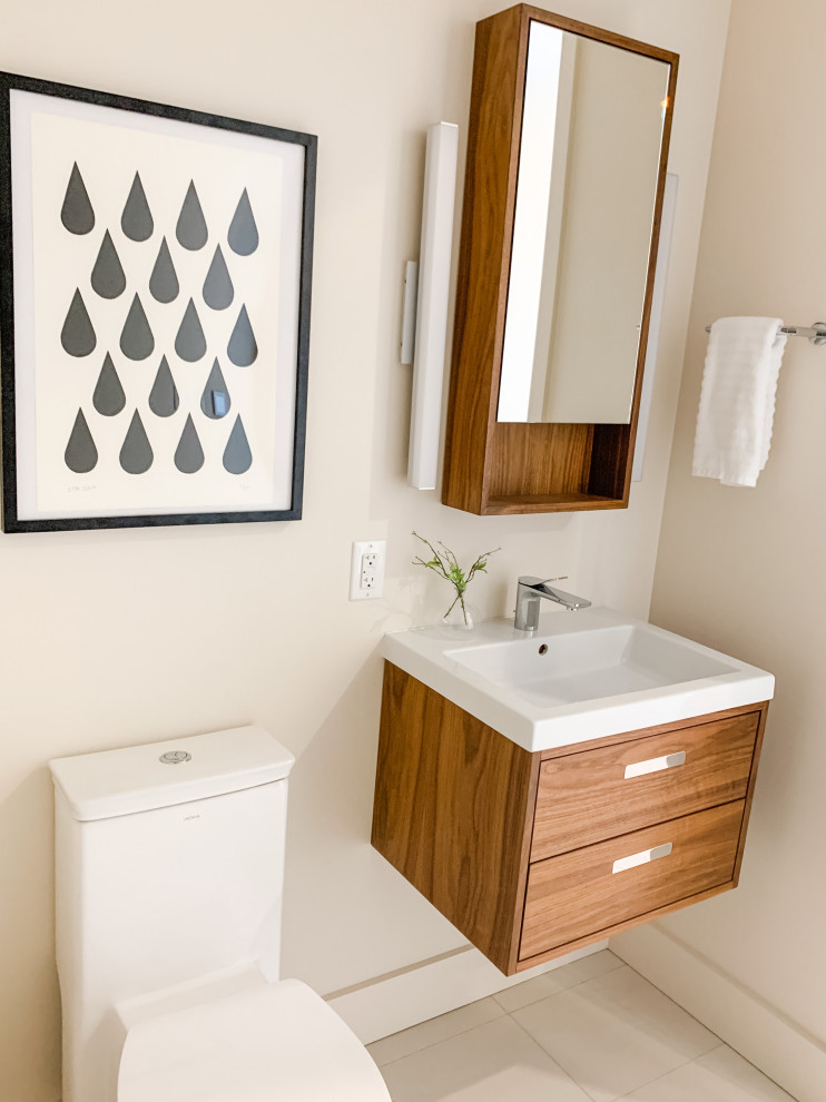 Kleines Modernes Duschbad mit flächenbündigen Schrankfronten, braunen Schränken, Toilette mit Aufsatzspülkasten, weißer Wandfarbe, weißem Boden, Wäscheaufbewahrung, Einzelwaschbecken und schwebendem Waschtisch in Portland Maine
