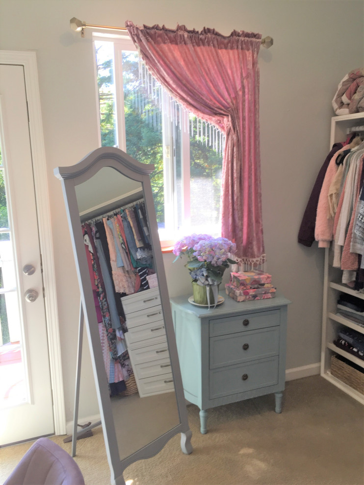 This is an example of a mid-sized traditional women's dressing room in San Francisco with shaker cabinets, white cabinets, carpet and beige floor.