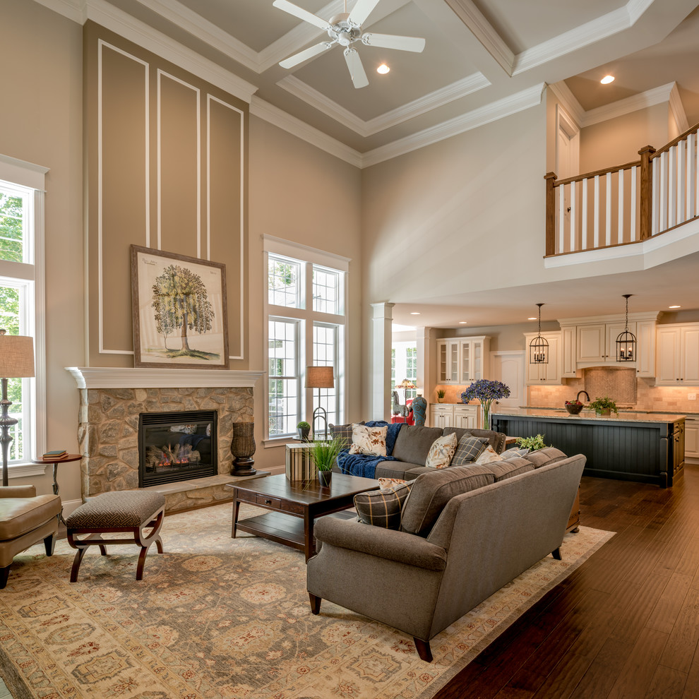 Traditional living room in Other with beige walls, dark hardwood floors, a standard fireplace and a stone fireplace surround.