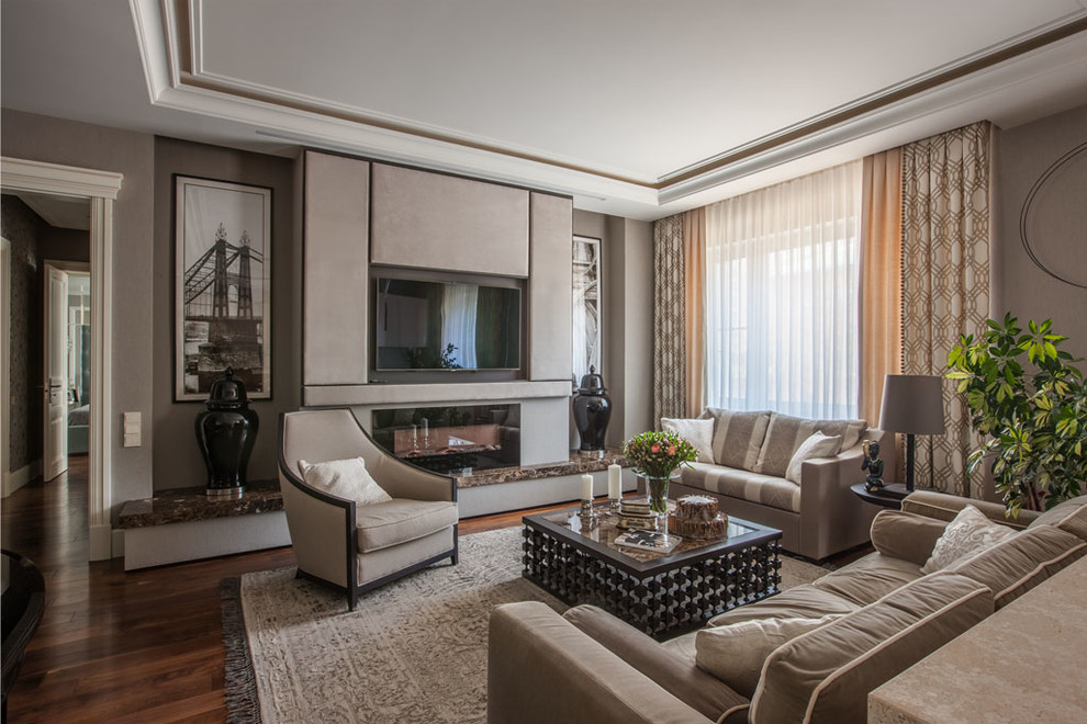Design ideas for a transitional formal open concept living room in Moscow with beige walls, medium hardwood floors, a standard fireplace, a wall-mounted tv and brown floor.