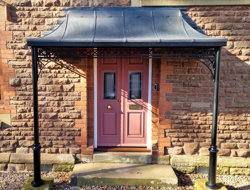Photo of a large classic porch in West Midlands with a double front door.