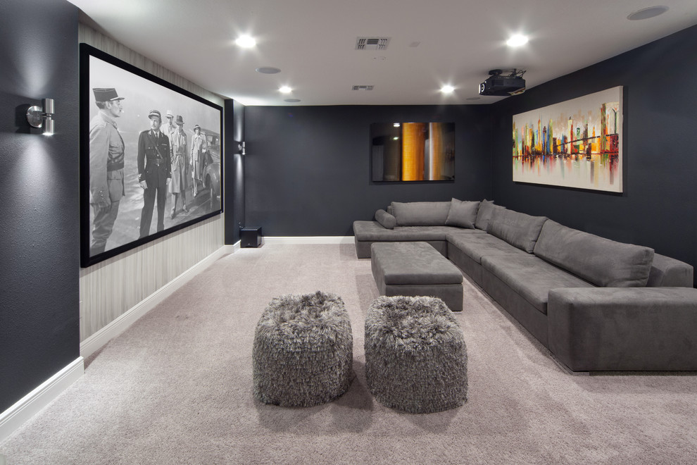 Photo of a mid-sized transitional enclosed home theatre in Orlando with black walls, carpet, a projector screen and grey floor.