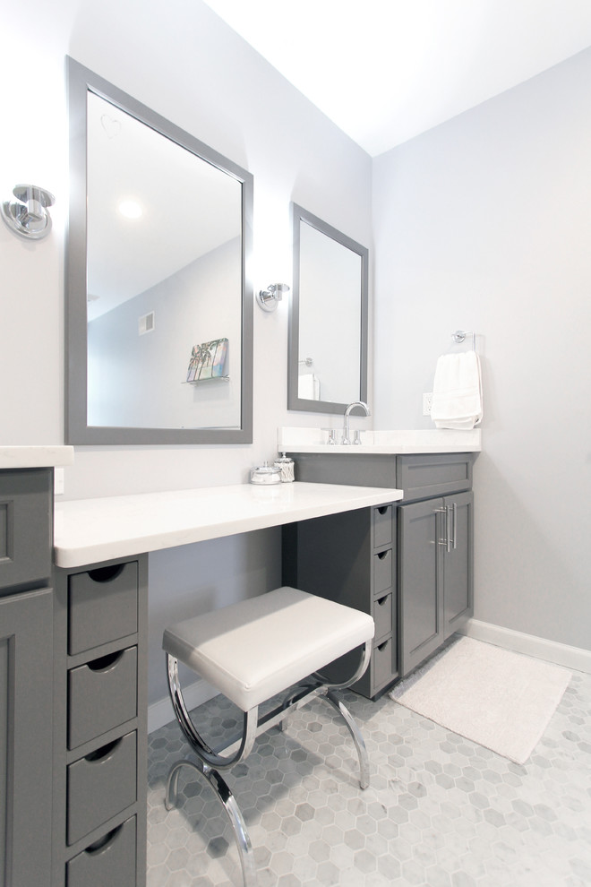 Mid-sized modern master bathroom in Philadelphia with an alcove shower, ceramic floors, grey floor, a hinged shower door, recessed-panel cabinets, grey cabinets, blue walls, an undermount sink, white benchtops and marble benchtops.