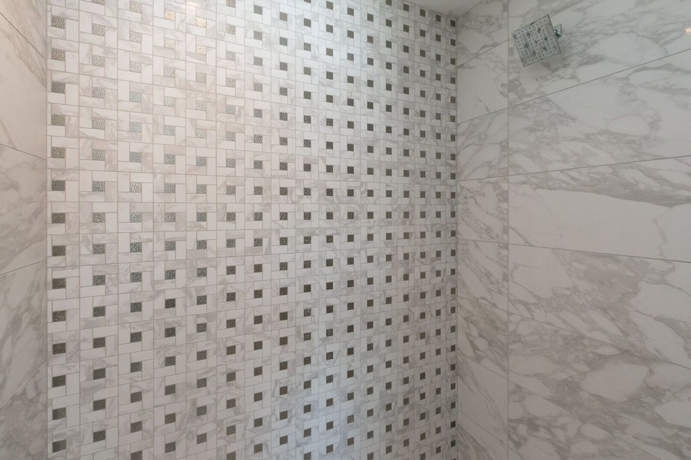 Inspiration for a mid-sized transitional ceramic tile marble floor freestanding bathtub remodel in Cedar Rapids with flat-panel cabinets, black cabinets, gray walls and an undermount sink