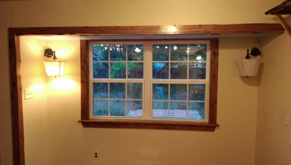 Example of a mid-sized galley medium tone wood floor eat-in kitchen design in Austin with a drop-in sink and no island