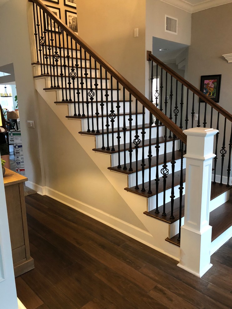 Design ideas for a mid-sized contemporary wood l-shaped staircase in Tampa with wood risers and wood railing.