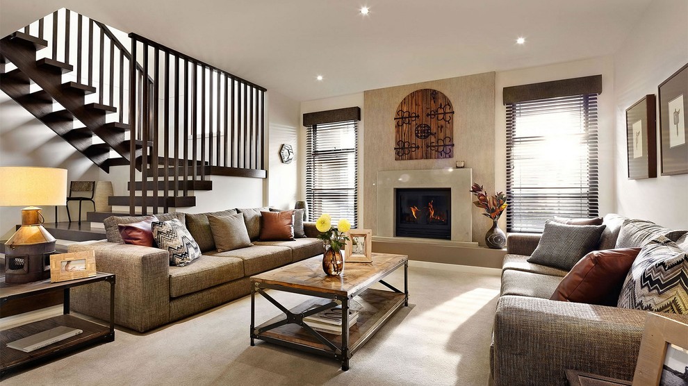 Inspiration for a transitional living room in Geelong with beige walls, carpet, a standard fireplace and beige floor.