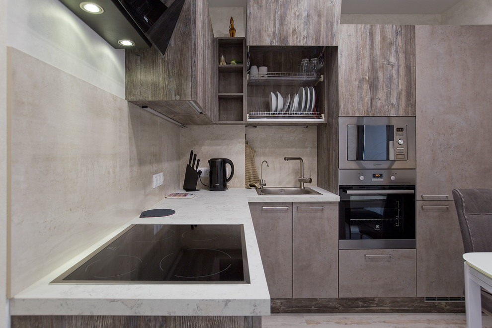 Inspiration for a small contemporary l-shaped separate kitchen in Saint Petersburg with a drop-in sink, flat-panel cabinets, brown cabinets, tile benchtops, beige splashback, marble splashback, stainless steel appliances, laminate floors, no island, white floor and grey benchtop.