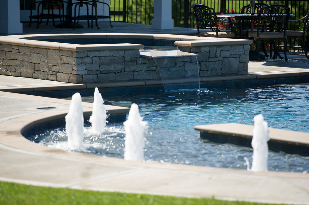 Pool house - large transitional backyard concrete and rectangular pool house idea