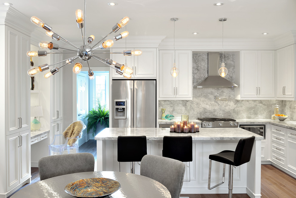 Photo of a contemporary l-shaped eat-in kitchen in Toronto with white cabinets, grey splashback, stone slab splashback, stainless steel appliances, light hardwood floors and with island.