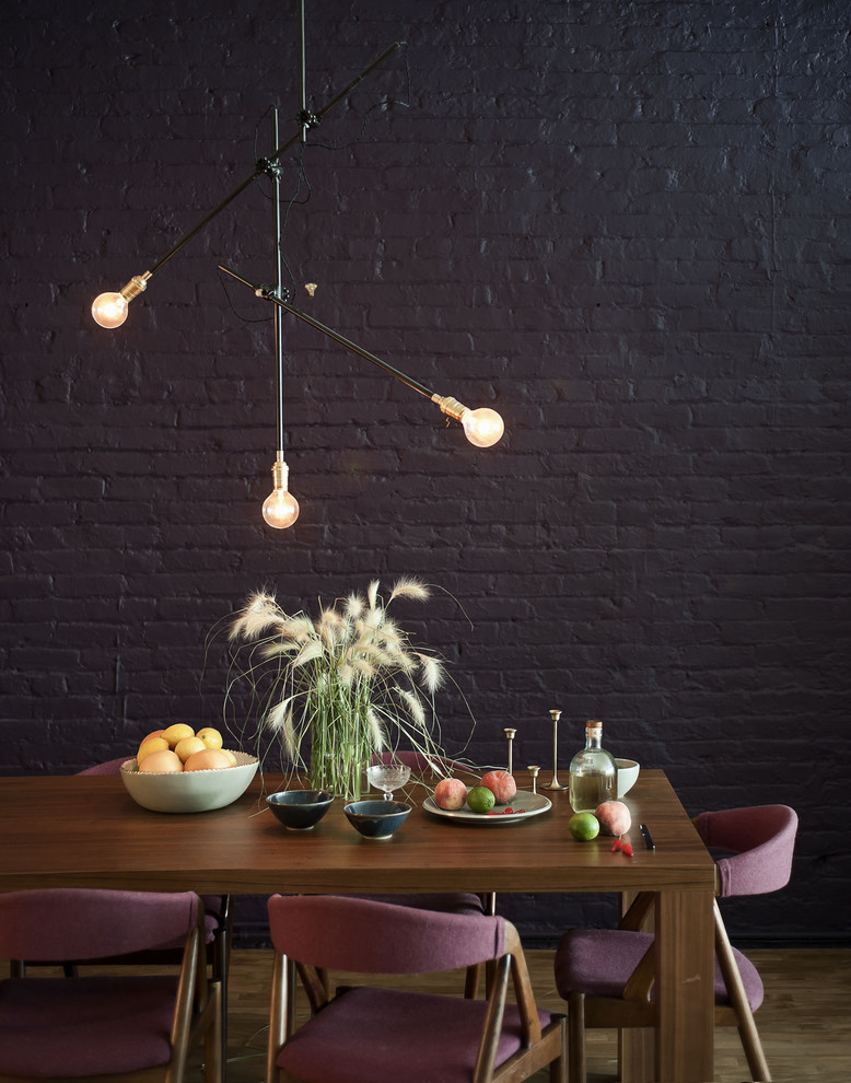 Inspiration for an expansive eclectic kitchen/dining combo in Auckland with black walls.