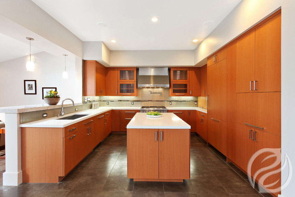 This is an example of a mid-sized midcentury u-shaped eat-in kitchen in Chicago with an undermount sink, flat-panel cabinets, light wood cabinets, quartz benchtops, beige splashback, porcelain splashback, stainless steel appliances, porcelain floors and with island.