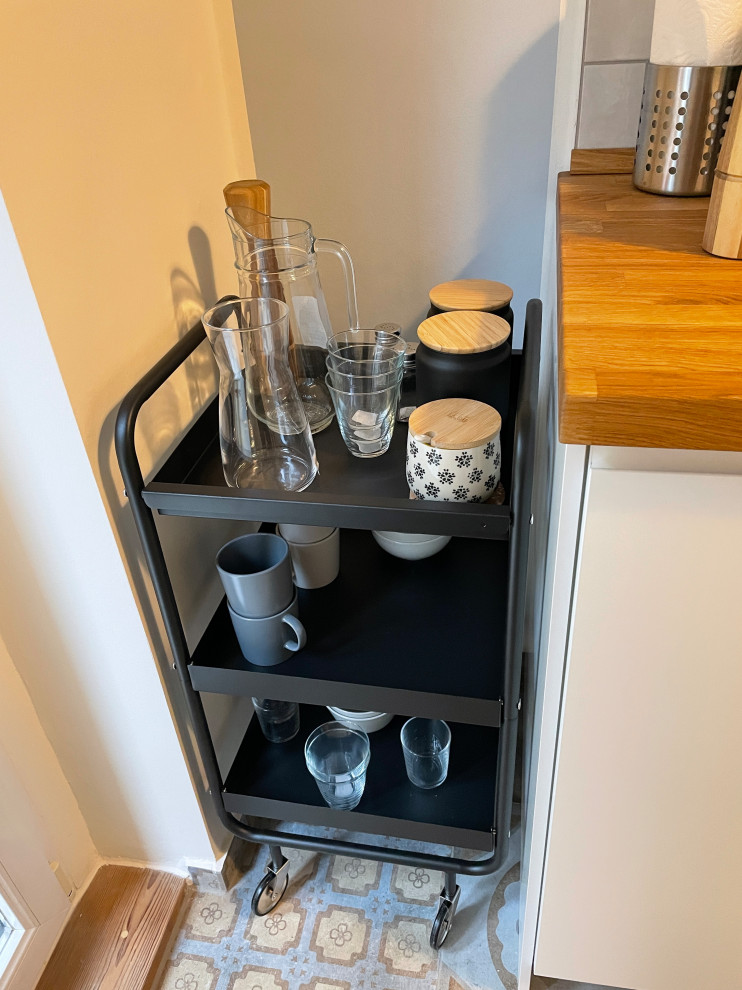 This is an example of a scandinavian galley separate kitchen in Berlin.