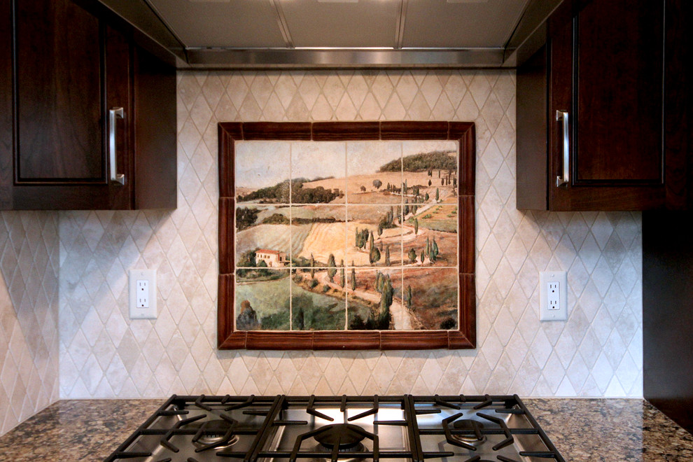 Kitchen pantry - large transitional concrete floor kitchen pantry idea in Phoenix with an undermount sink, louvered cabinets, dark wood cabinets, granite countertops, beige backsplash, stone tile backsplash, stainless steel appliances and an island