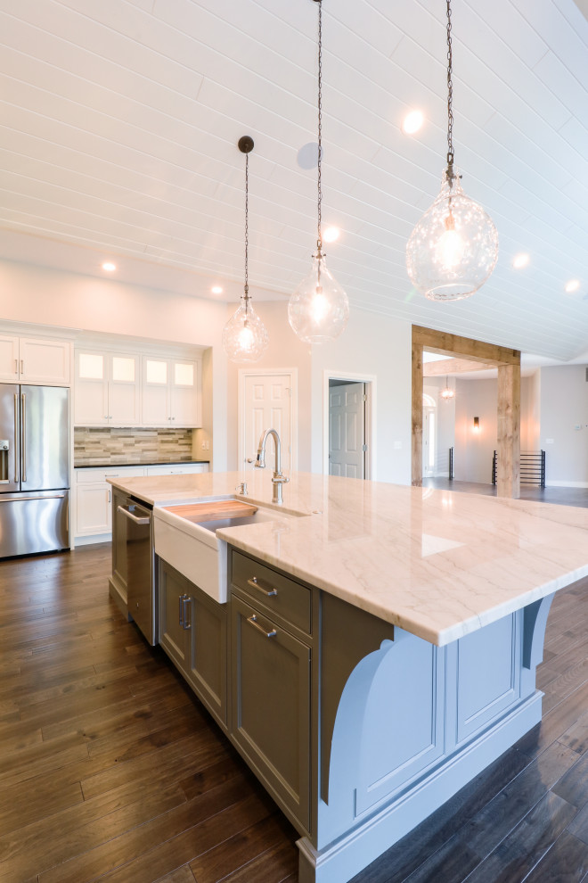 This is an example of an expansive arts and crafts l-shaped open plan kitchen in Other with shaker cabinets, grey cabinets, marble benchtops and with island.