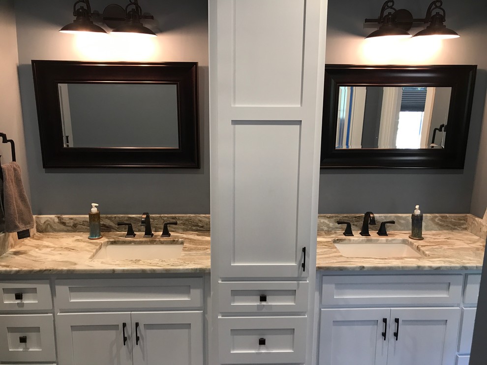 This is an example of a mid-sized transitional master bathroom in Raleigh with shaker cabinets, grey cabinets, onyx benchtops, an alcove shower, grey walls, an undermount sink and a sliding shower screen.