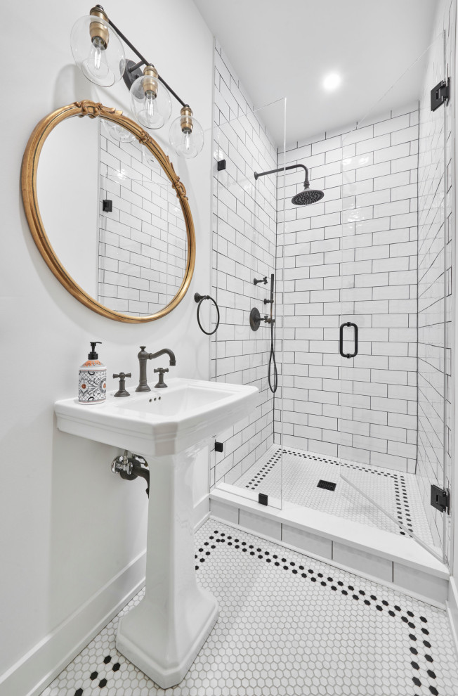 This is an example of a small nautical bathroom in Chicago with recessed-panel cabinets, white cabinets, a two-piece toilet, white tiles, porcelain tiles, white walls, porcelain flooring, a pedestal sink, quartz worktops, white floors, a hinged door, white worktops, a single sink and a freestanding vanity unit.