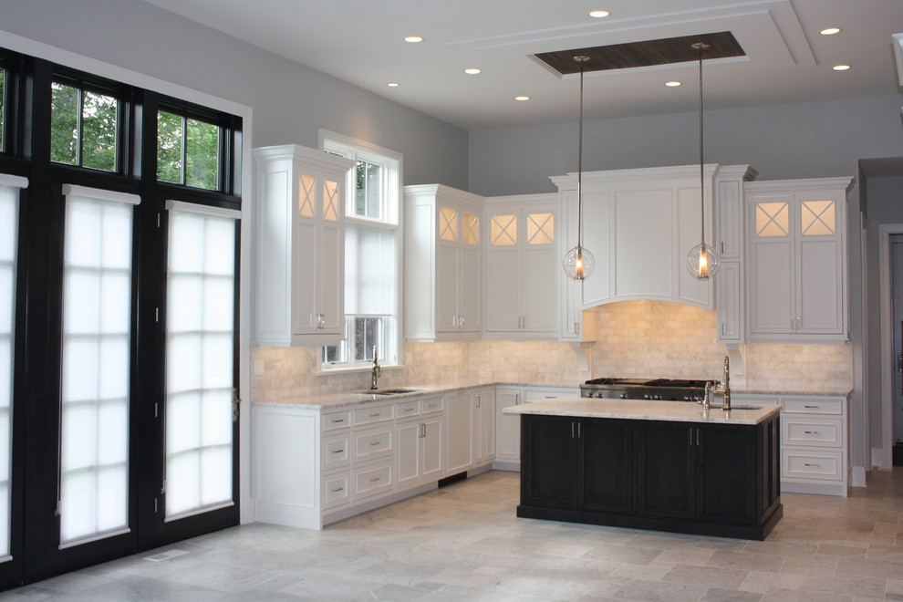 Inspiration for a large transitional u-shaped open plan kitchen in Chicago with a double-bowl sink, beaded inset cabinets, white cabinets, quartzite benchtops, white splashback, subway tile splashback, stainless steel appliances, marble floors and with island.