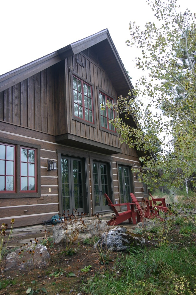 Photo of a country two-storey brown exterior in Boise with wood siding.