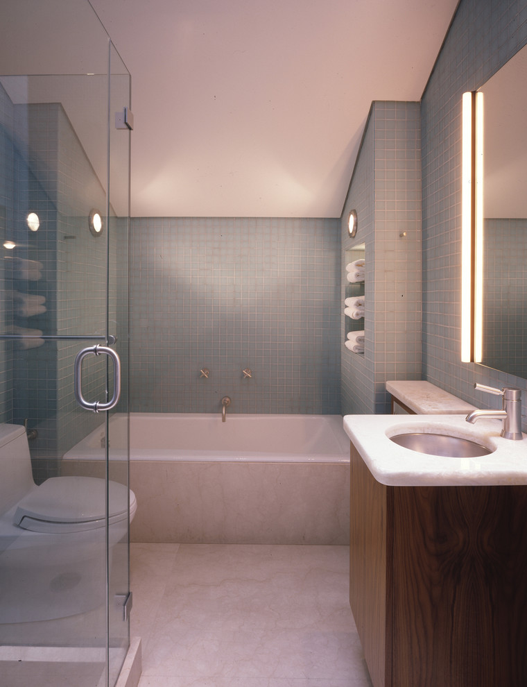 Inspiration for a contemporary bathroom in San Francisco with an undermount sink, flat-panel cabinets, dark wood cabinets, an alcove tub, a corner shower, a one-piece toilet, blue tile and mosaic tile.