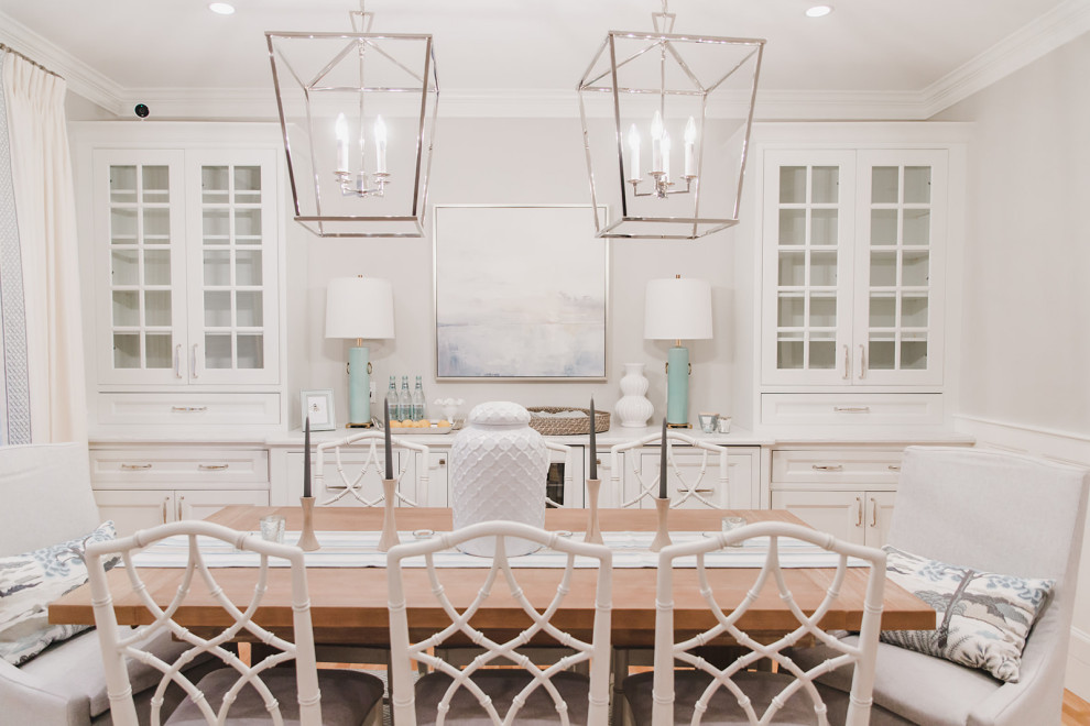 This is an example of a mid-sized beach style open plan dining in Boston with grey walls and light hardwood floors.