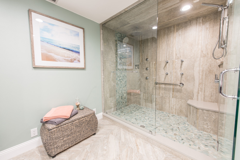 Photo of a mid-sized contemporary master bathroom in Other with shaker cabinets, dark wood cabinets, an alcove shower, a two-piece toilet, beige tile, pebble tile, green walls, porcelain floors, an undermount sink, engineered quartz benchtops and a hinged shower door.