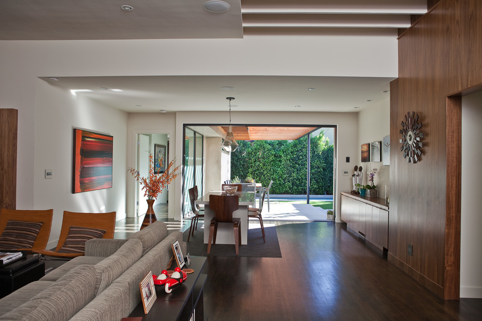 Photo of a large modern formal open concept living room in Los Angeles with white walls and carpet.
