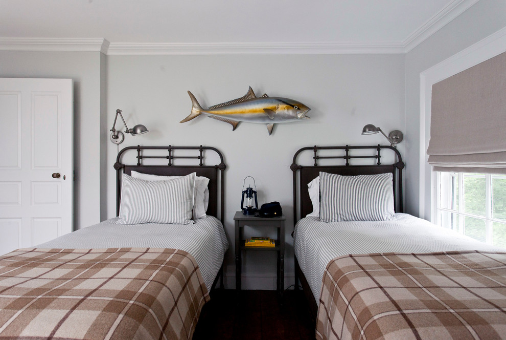 Beach style guest bedroom in New York with grey walls.