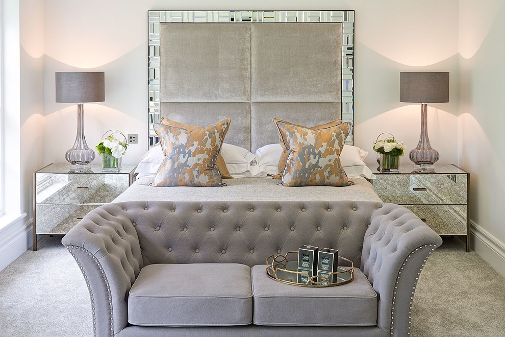 Inspiration for a transitional bedroom in Surrey with white walls, carpet and no fireplace.
