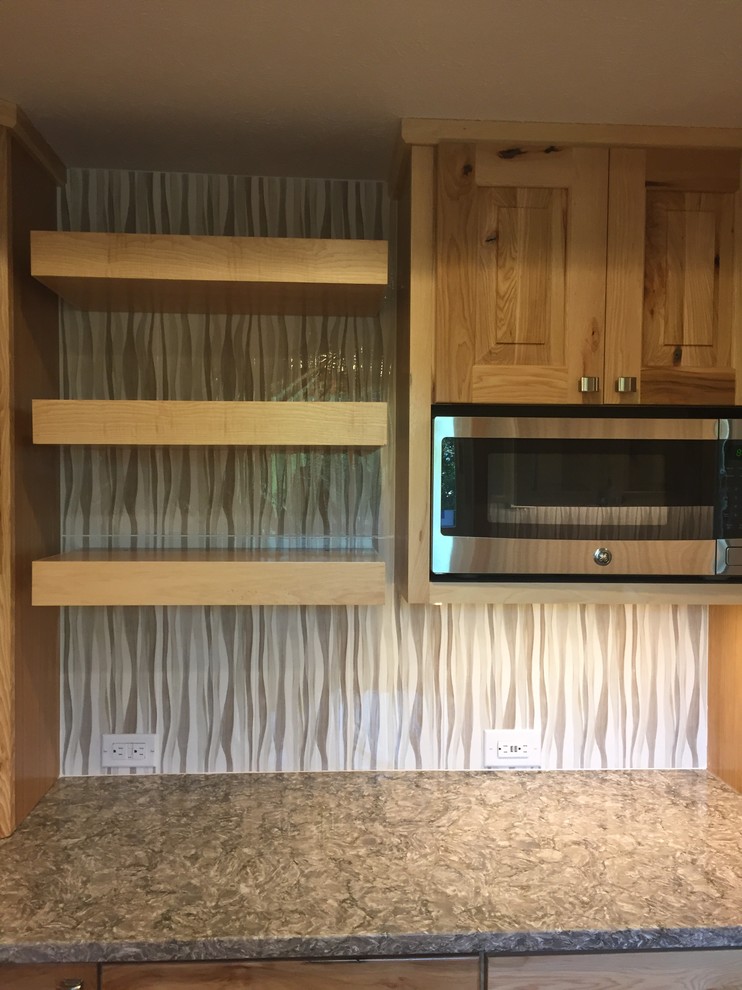 Inspiration for a mid-sized rustic u-shaped laminate floor and brown floor eat-in kitchen remodel in Omaha with an undermount sink, raised-panel cabinets, light wood cabinets, quartz countertops, beige backsplash, porcelain backsplash, stainless steel appliances, an island and gray countertops