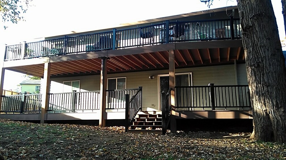 Large trendy backyard deck photo