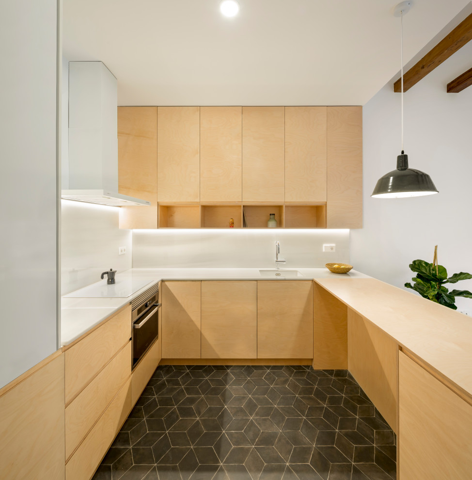 This is an example of a small scandinavian u-shaped eat-in kitchen in Other with an undermount sink, open cabinets, light wood cabinets, marble benchtops, white splashback, marble splashback, panelled appliances, ceramic floors, with island, black floor and white benchtop.