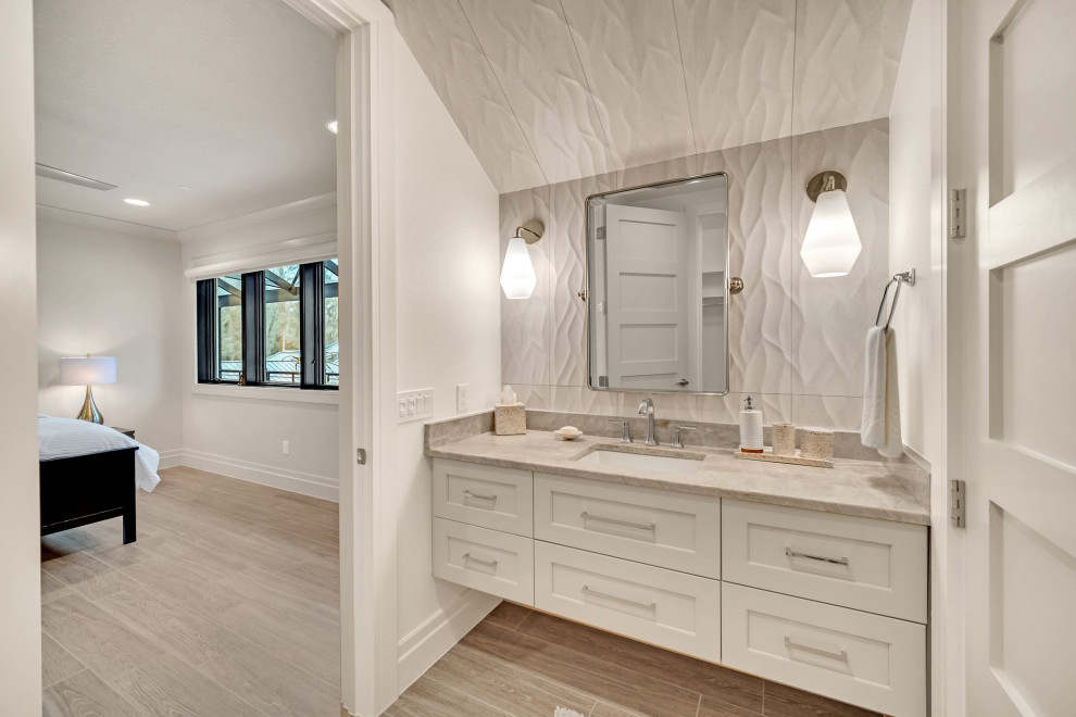 Mid-sized transitional master single-sink bathroom photo in Orlando with light wood cabinets, a floating vanity and shaker cabinets