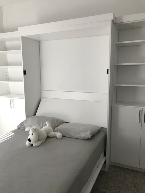 Inspiration for a mid-sized transitional guest bedroom remodel in DC Metro with white walls