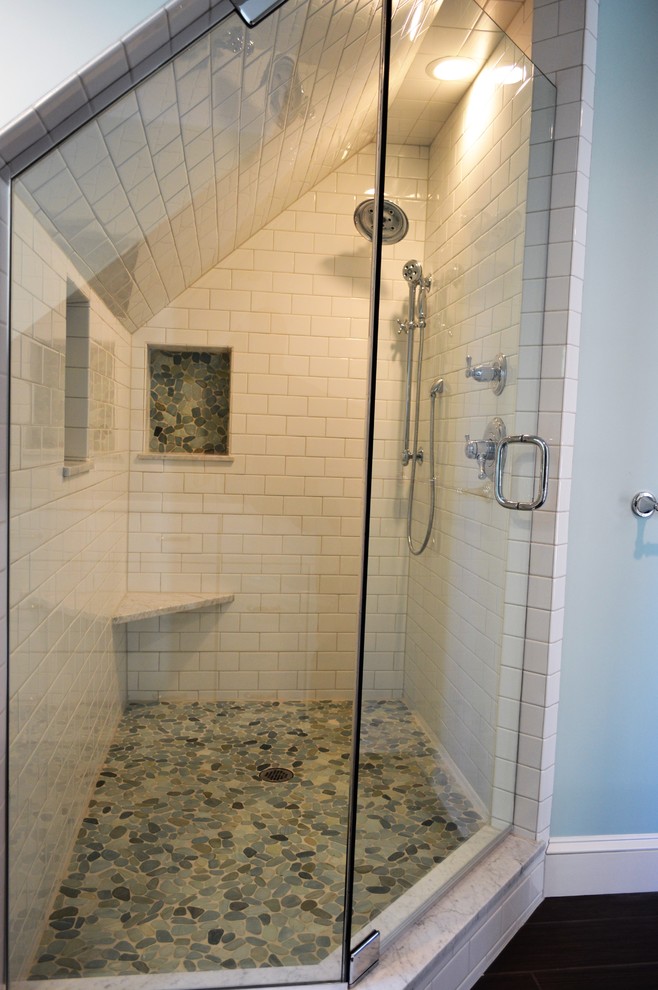 This is an example of a mid-sized country master bathroom in Boston with flat-panel cabinets, white cabinets, an alcove shower, a two-piece toilet, white tile, blue walls, terra-cotta floors, an undermount sink and marble benchtops.