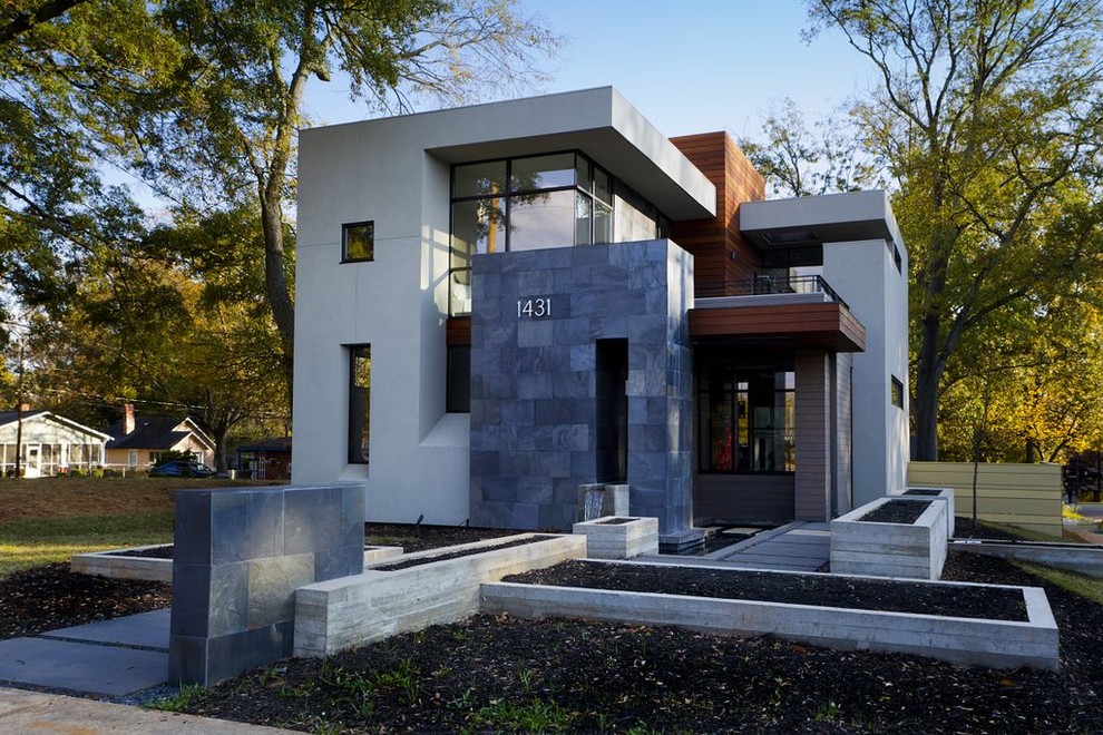 Design ideas for a mid-sized contemporary two-storey exterior in Atlanta.