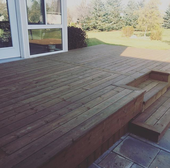 Inspiration for a large transitional backyard deck remodel